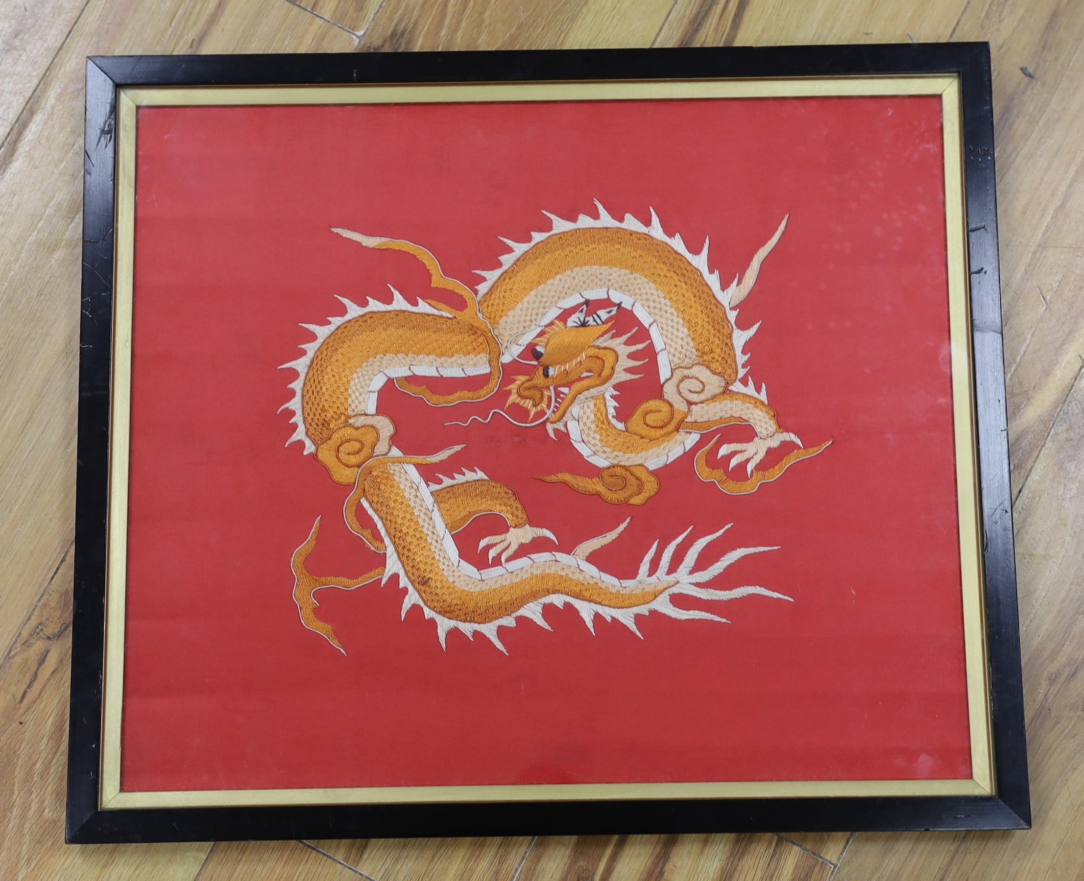 A framed silk Chinese dragon embroidery, 47.5cm wide x 39.5cm high